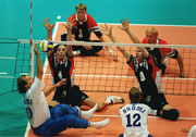 General action between Finland v Netherlands in the men's Sitting Volleyball quarterfinals during the 2000 Paralympic Games  Adam Pretty/Allsport 