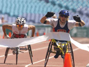 Jean Driscoll of USA celebrates winning Gold in the womens Marathon in class 54 final during the Sydney 2000 Paralympic Games.  Nick Wilson/Allsport