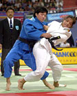Picture of women judokas competing. Hip technique. Photograph  Bob Willingham, IJF Photographer