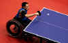 Toshihiko Oka of Japan in action in his Table Tennis singles match against Yen-Hung Lin of Chinese Taipei during the 2000 Paralympic Games.  Scott Barbour/Allsport