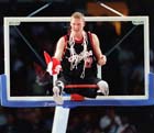 Photo of Paralympic athlete celebrating on basketball hoop